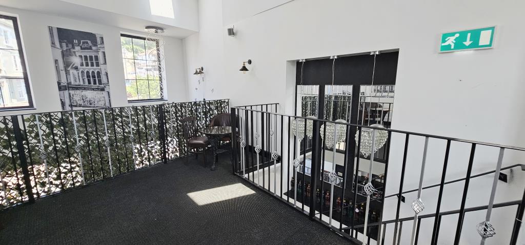 Lot: 173 - TOWN CENTRE FREEHOLD THREE STOREY BAR WITH GARDEN AND PARKING - The upper floor food/bar area